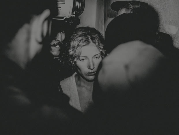 Vintage black-and-white shot of an actress in a crowd